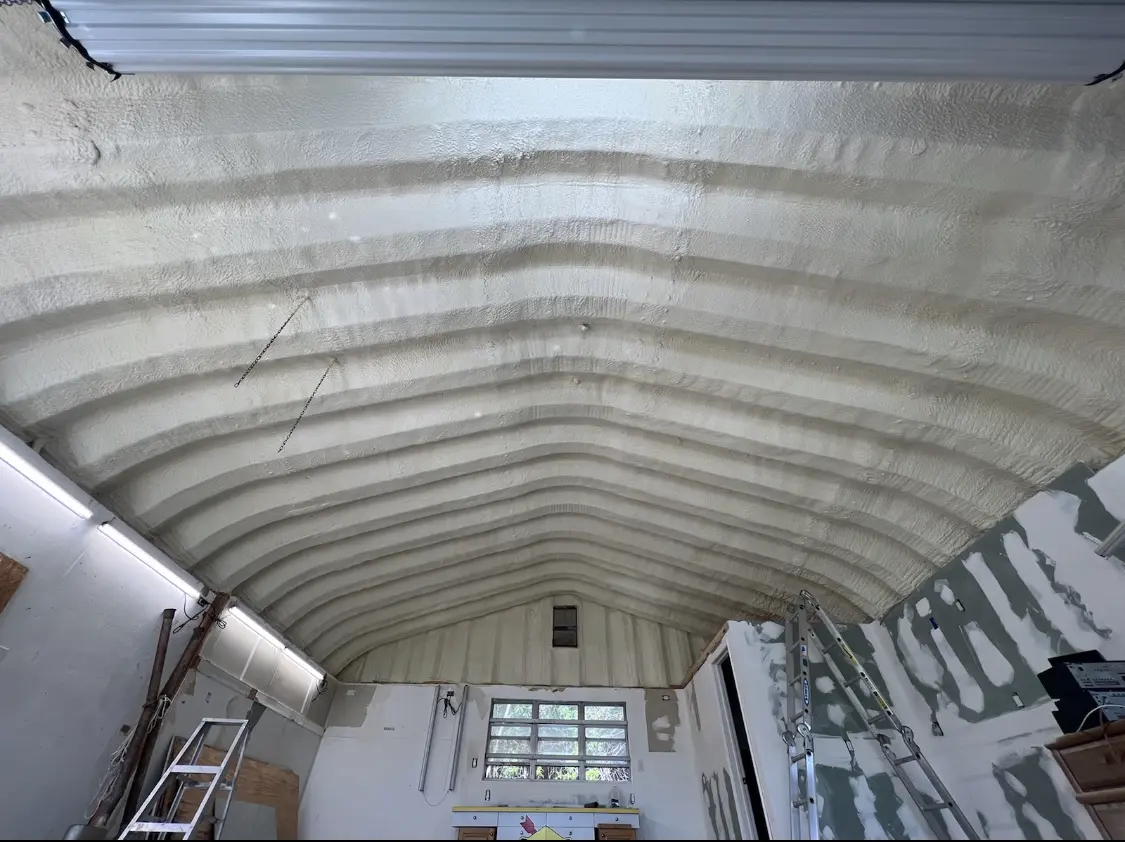 Spray polyurethane foam applied to the underside of a metal roof deck in Wrentham